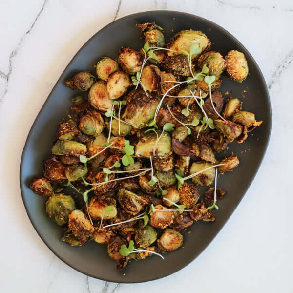 Blog - ‘Cheesy’ Roasted Brussels with a Green Tahini Sauce - MonicaYates